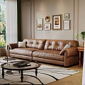 Cozy Living Room Interior With Brown Leather Sofa Framed Paintings And Round Coffee Table