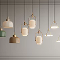 Modern Colorful Pendant Lights Featuring Green Beige Shades Gold Frames and Diverse Shapes for Interior Decor