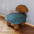Mushroom Shaped Single Chair With Blue Cushion Brown Backrest And Legs On Wooden Floor