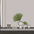 White Vases With Green Palm Leaves In Modern Interior Decor With Circular Wall And Candles