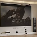 Home Theater Setup With Projector Screen Black Myth Wukong Poster Speakers And Robot Figurine