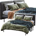 Modern Double Bed With Gray Headboard Green White Pillows And Blue Orange Blankets