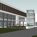 Modern Commercial Complex With Glass Facade Entrance Plaza And Green Landscaping