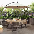 Elegant Villa Balcony Outdoor Living Area With Dining Table Chairs Umbrella Green Plants And Flowers