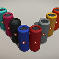 Vibrant Cylindrical Speakers with Multiple Colors Arranged in Arc and Brand Logo