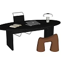 Modern Wooden Desk With Oval Top Featuring Laptop Lamp And Open Book Near Brown Stool