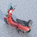 Red Scooter With Windshield And Black Seat On Gray Paved Surface