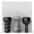 Elegant Modern Washbasin With Black Marble Pillars And Textured White Wall
