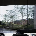 Modern Garden Landscape With Circular Water Feature Trees And Grassy Mounds