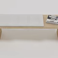 Simple Wooden Ottoman With Padded Seat And Stacked Magazines On Top