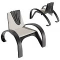 Stylish Leisure Chair With Curved Black Frame Light Colored Cushion And Gray Blanket On Back