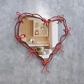 Heart Shaped Mirror with Red Ribbon Bow Frame Reflecting Bedroom Interior and Wooden Walls