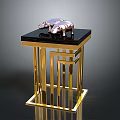 Small Table With Black Tabletop And Golden Metal Frame Featuring Two Pink Pig Shaped Ornaments