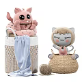 Pink Plush Cat and Grey-White Stuffed Toys in Woven Baskets with Blue Blanket Yarn Ball