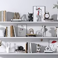 Decorative Ornament Set on White Shelves with Books Small Sculptures Framed Art and Vases