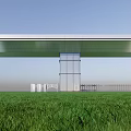 Modern Glass Entrance Gate With White Wall Green Lawn And Blue Sky