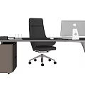 Modern Office Desk Setup With Gray Leather Chair Apple Monitor And Keyboard