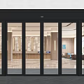 Modern Commercial Entrance With Black Frame Glass Sliding Doors And Lobby Interior