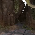 Natural Cave Entrance With Rocky Walls Green Vines And Stone Path