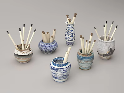 Assorted Decorative Ceramic Vessels With Wooden Paintbrushes And Blue White Patterns 3d model