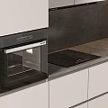 Modern Kitchen Interior With White Cabinets Dark Countertop And Built in Appliances
