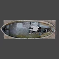Vintage Weathered Blue Wooden Boat With Worn Paint On Gravel Platform