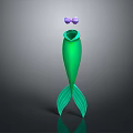 Green Mermaid Tail Decorative Ornament With Purple Bow Standing On Dark Background