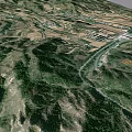 Aerial View Of Rural Mountainous Landscape With River Road And Farmland