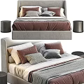 Cozy Upholstered Gray Double Bed With Brown Gray Beige Pillows And Textured Blanket