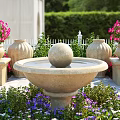 Garden Ornaments Featuring Stone Fountain Flower Pots and Pink Purple Flowers with Lush Greenery