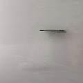 Modern Minimalist Faucet With Smooth Water Flow Against Light Colored Wall And Floor