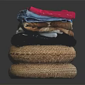 Colorful Fabrics With Soft Textures Stacked On Woven Mats Black Background