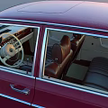 Red Vintage Classic Sedan With Open Doors Showcasing Luxurious Interior