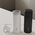 White And Black Leidfor Vacuum Flasks With Open Lid On Marble Countertop