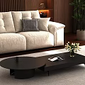 Modern Cream Colored Sofa And Black Coffee Table Set In Warm Interior With Plush Pillows Flower Vase And Green Plant