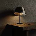 Vintage Helmet Designed Table Lamp With Warm Glow On Wooden Desk And Textured Wall