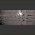 Modern Automotive Tire With Metallic Alloy Wheel Spoke Design And Tread Pattern