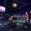 Modern Bar Interior With Neon Lighting Bar Counter High Stools And Screens