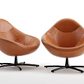 Pair of Brown Leather Accent Chairs with Curved Design and Black Metal Swivel Base