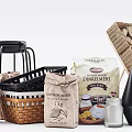 Baking Essentials Cocoa Powder Flour in Paper Bags Wicker Baskets and Glass Jar