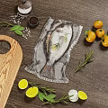 Fresh Vacuum Sealed Fish with Lemon Slices Rosemary Tomatoes Salt Pepper on Wooden Cutting Board