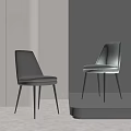 Sleek Gray Leather Dining Chair With Modern Metal Legs And Curved Backrest Design