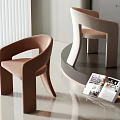 Modern Brown And Beige Velvet Single Chair In Contemporary Interior With Open Magazine
