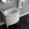 Stylish White Vanity with Oval Mirror Gold Accents and Wall Cabinet in Gray Striped Bathroom