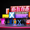 Vibrant Stage Setup With LED Screens Guitars Welcome Fashion District And Love Fitness Signs