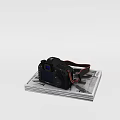 Black Digital Camera With Red Strap On Gray Platform And Blue Screen