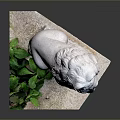 Detailed White Stone Lion Statue Sitting On Pedestal With Green Plants