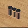 Three Brown And Beige Spice Jars With Black Lids On Wooden Tabletop