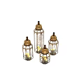 Gold Ornate Candle Lanterns With Intricate Cutout Design And Glass Enclosures Holding Candles