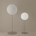Modern Floor Lamps With White Round Shades Metal Stands And Circular Bases In Light Background